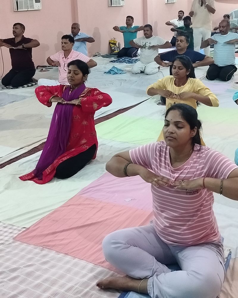 Students practising a calm breathing exercise with eyes closed